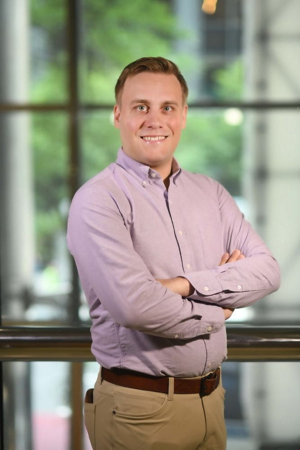 Professional headshot photographed at ThisPix studio in Midtown Manhattan