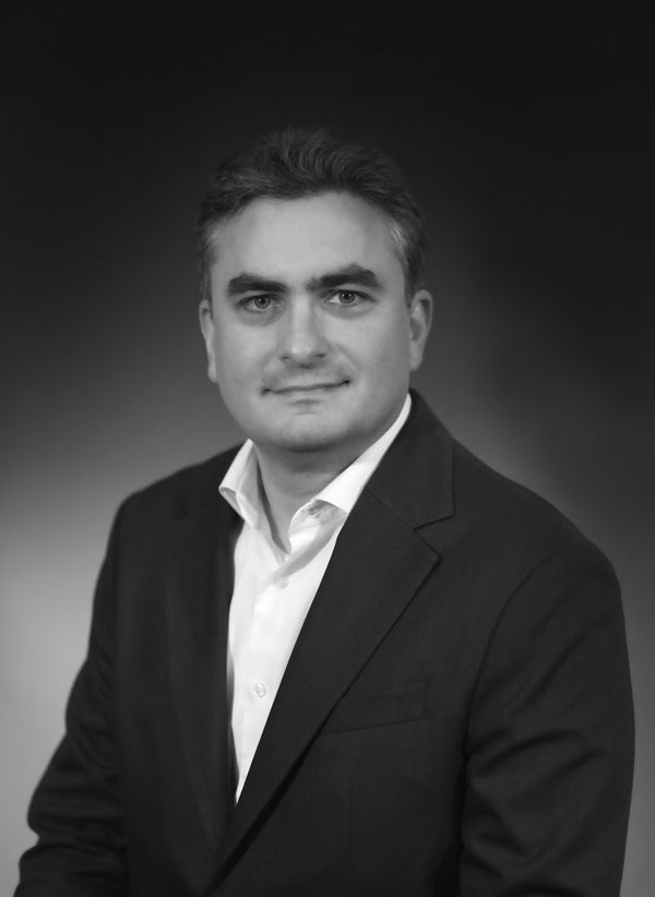 Professional headshot photographed at ThisPix studio in Midtown Manhattan