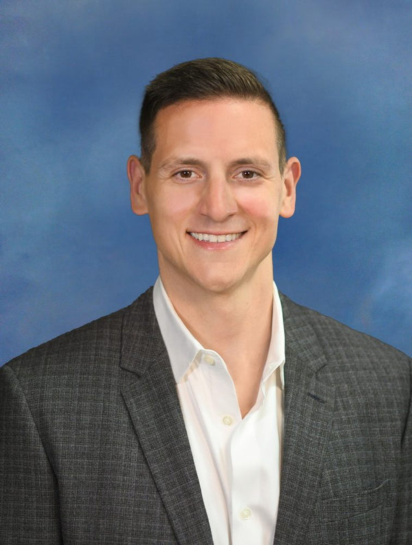 Professional headshot photographed at ThisPix studio in Midtown Manhattan